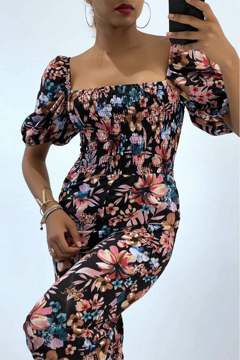 Gebloemde zwarte jumpsuit met bell bottoms en strapless top met elastische borst, essentieel voor de zomer - 4