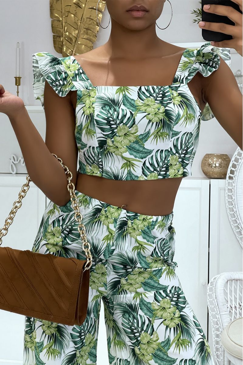 Prachtige witte bloemenset met olifantenbeenbroek met splitten aan de zijkanten en crop top die aan de achterkant gestrikt wordt