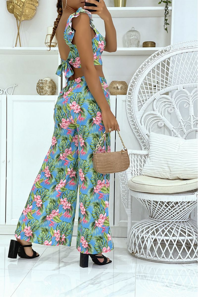 Prachtige bloemen turquoise set met olifant been broek met splitten aan de zijkanten en crop top die aan de achterkant gestrikt 