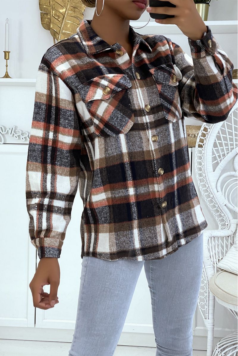 On a warm and soft brown checked shirt - 1