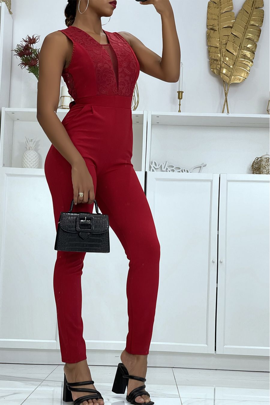 Tight and comfortable red jumpsuit with lace and tulle details on the neckline  - 1