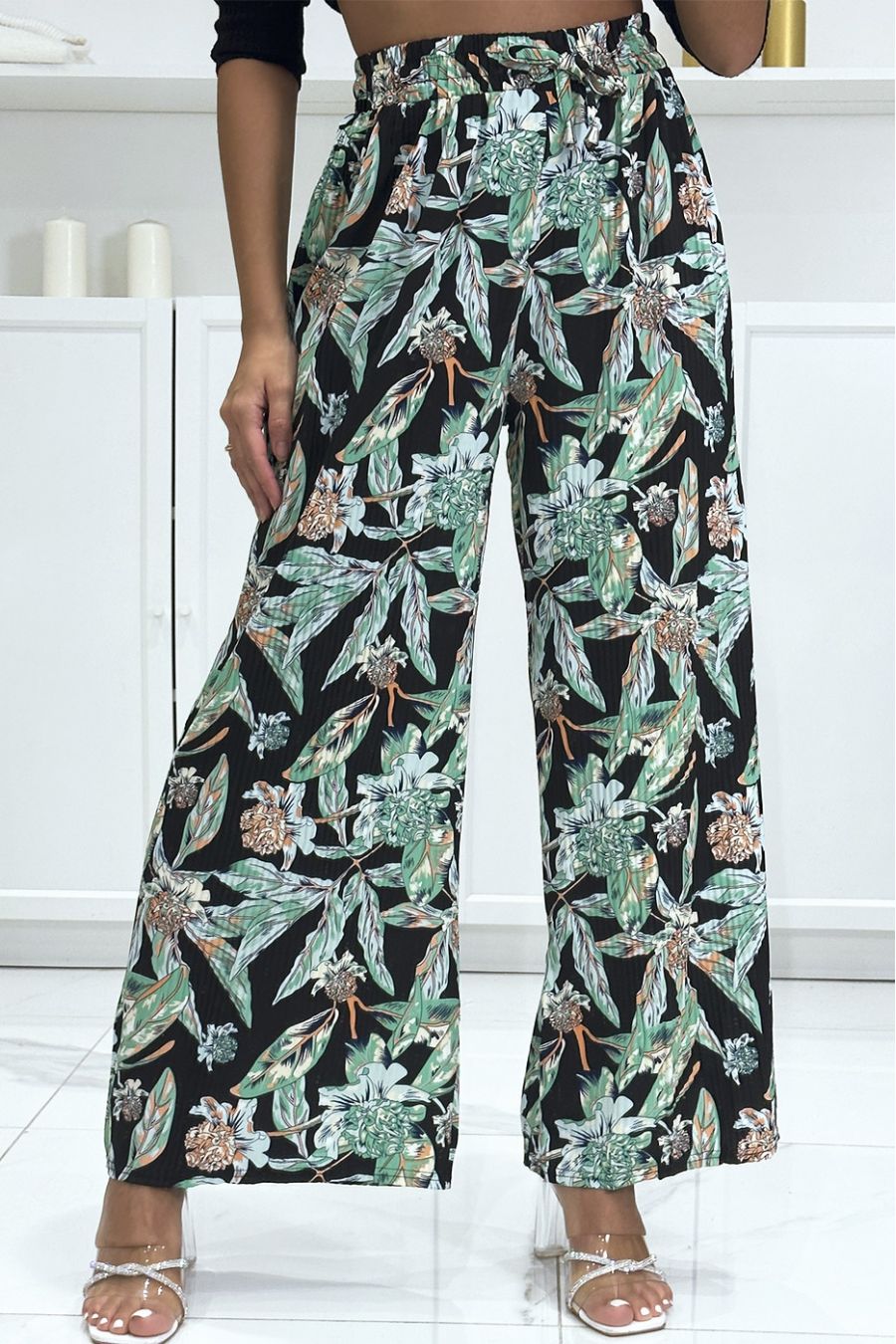 Black pleated palazzo pants with floral pattern