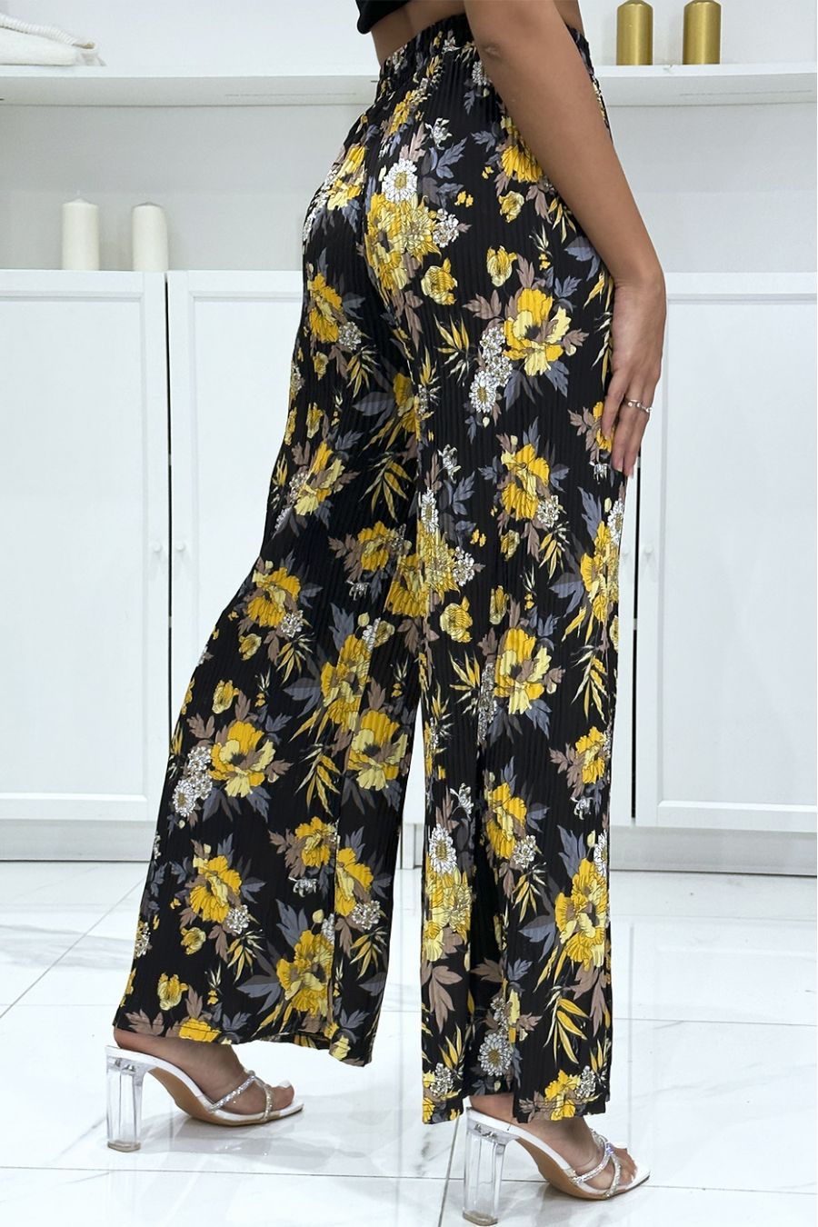 Black pleated palazzo pants with floral pattern