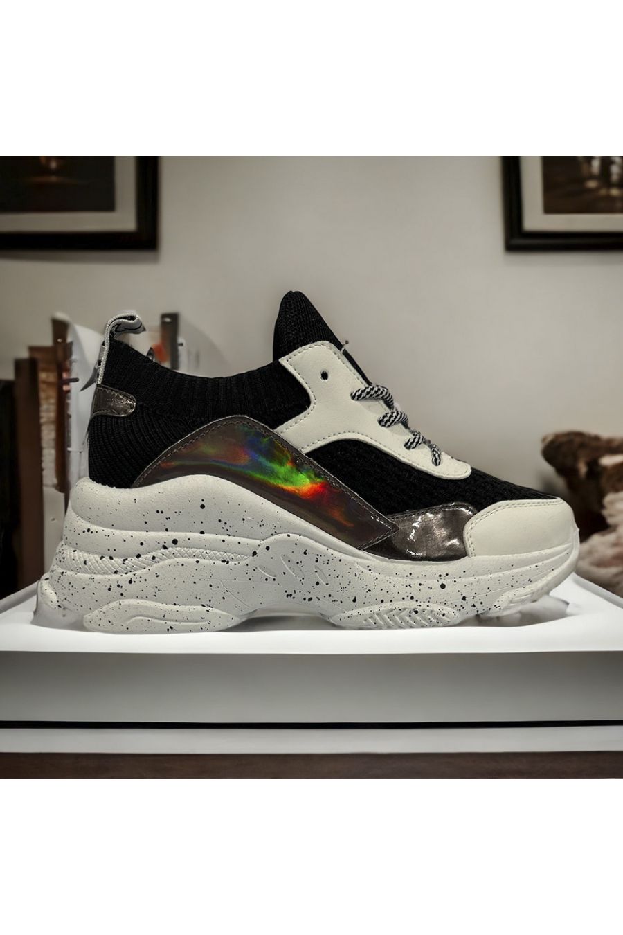 Black and white wedge sneakers with paint effect on the sole