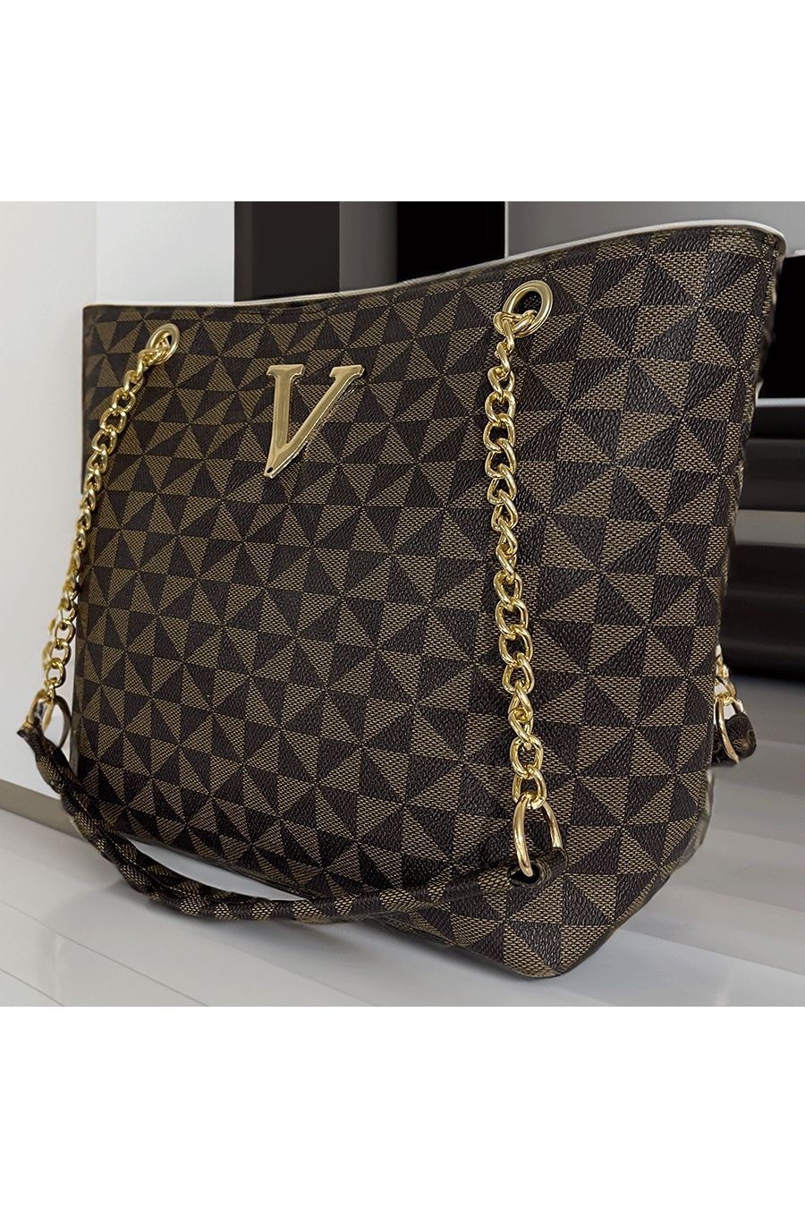 Brown patterned V handbag - 1