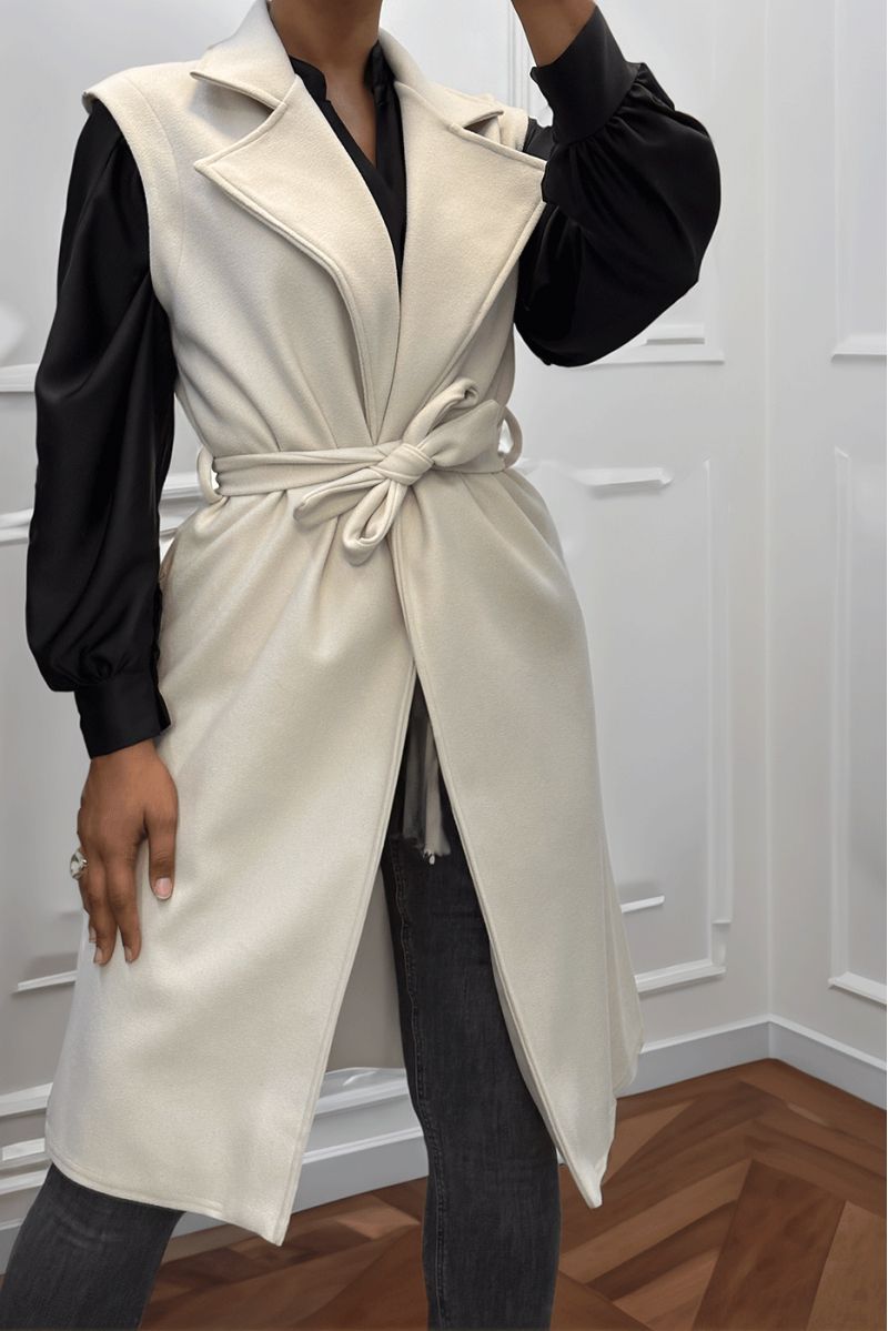 Long beige fluid sleeveless trench coat with belt - 1