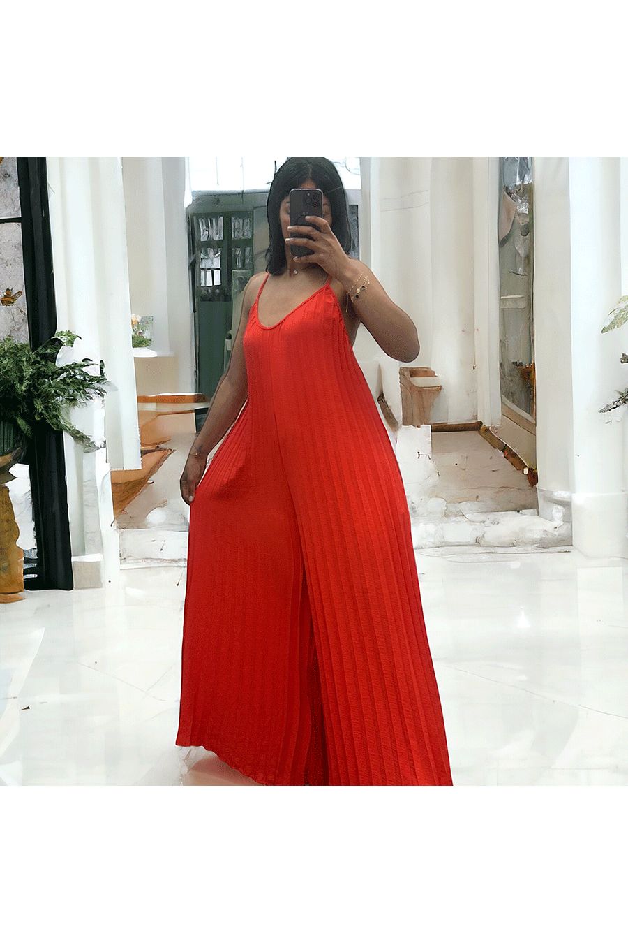 Pleated palazzo jumpsuit in orange - 1