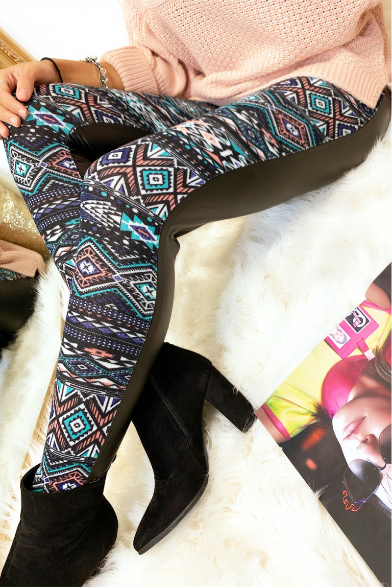 Colorful winter leggings in coral and black, fantasy patterns and sky behind. Fashion style. 148-2 - 2
