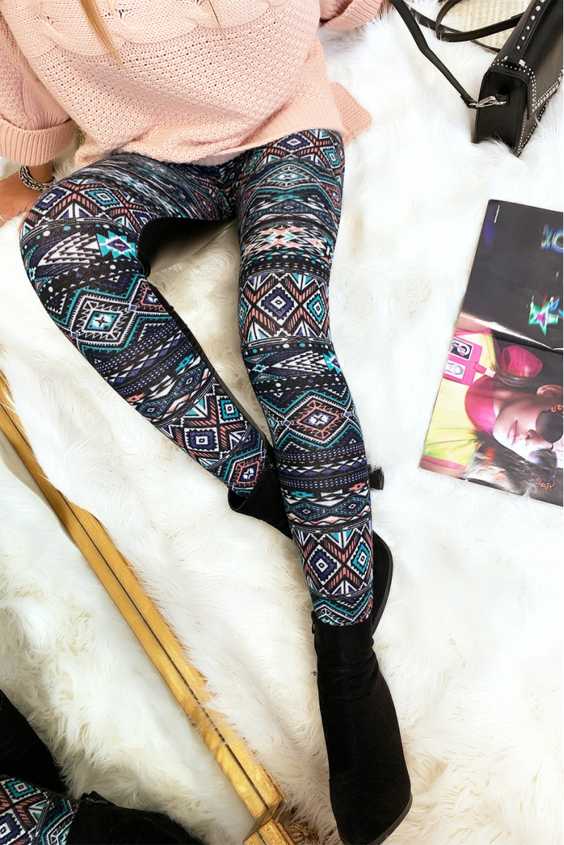 Colorful winter leggings in coral and black, fantasy patterns and sky behind. Fashion style. 148-2 - 4