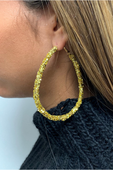 Boucle d'oreille doré. - 1