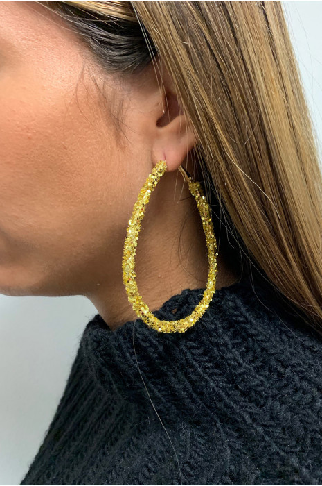 Boucle d'oreille doré. - 2