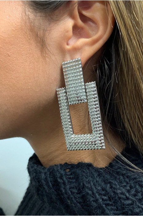 Boucle d'oreille argenté. - 1