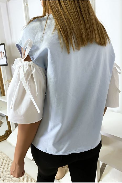 Blauwe top van twee materialen met blote pofmouwen - 6