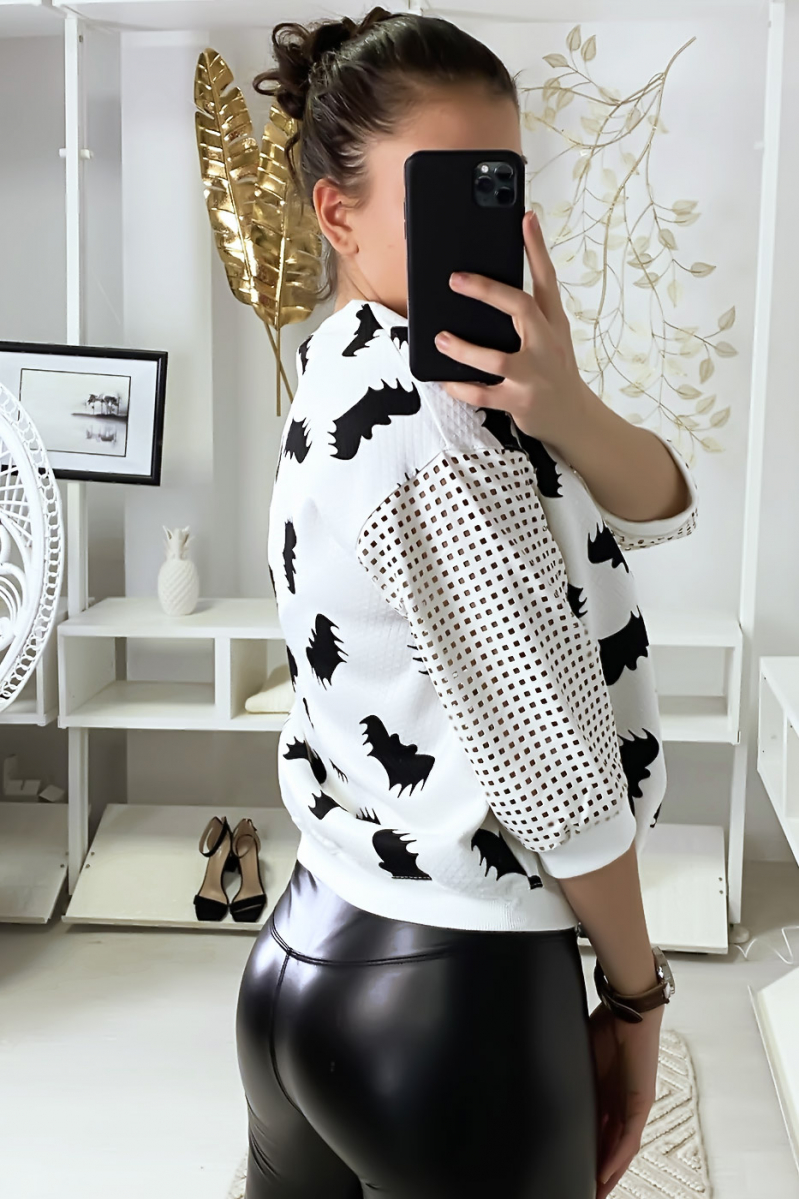 White sweater with bat motif and sleeves with checkered holes. - 1