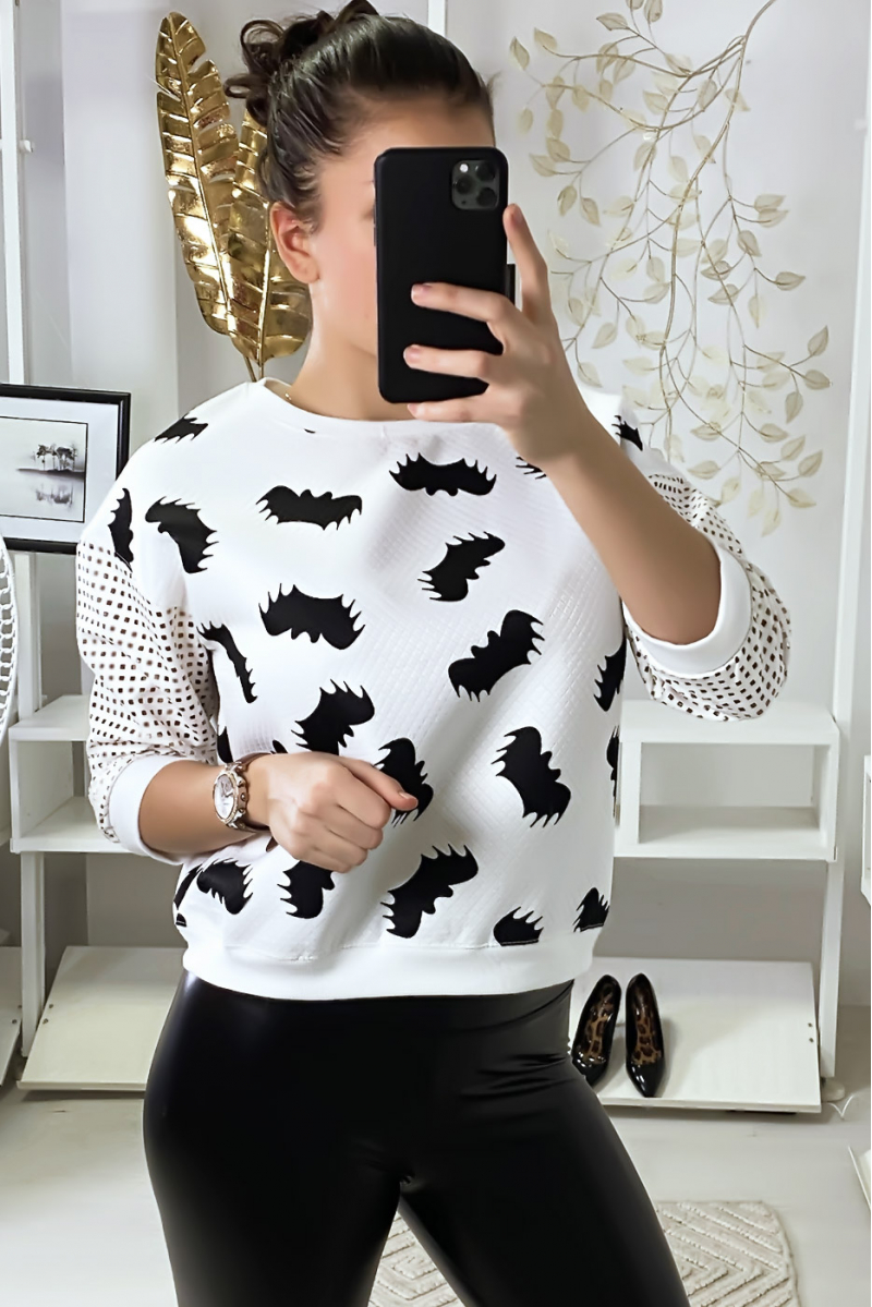 White sweater with bat motif and sleeves with checkered holes. - 3