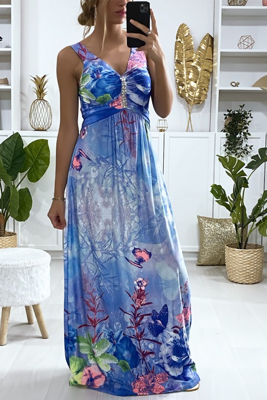 Longue robe motif fleuris bleu avec accessoire au buste