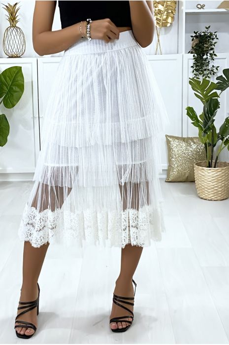 Jupe blanche en voile brodé à volant. - 4