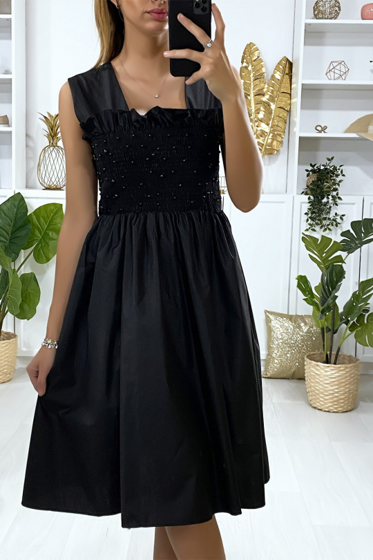 Flared black dress with pearls and elastic at the bust - 4