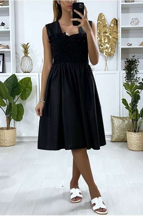 Flared black dress with pearls and elastic at the bust - 1