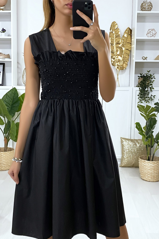 Flared black dress with pearls and elastic at the bust - 3