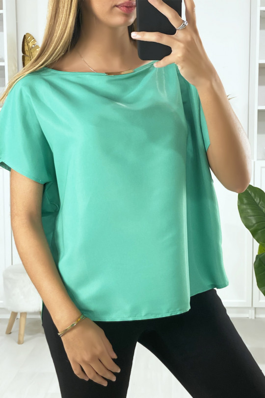Green batwing blouse with gold accessory at the collar - 1