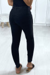 Black skinny jeans buttoned at the front with pockets