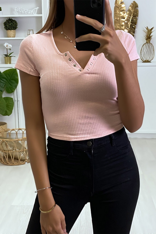 Pink ribbed V-neck cropped top with decorative press studs. - 1